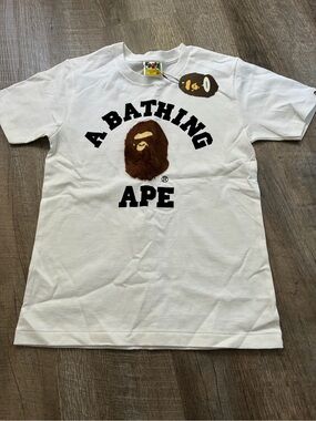 A Bathing Ape White Logo Graphic Tee with Brown Ape Emblem